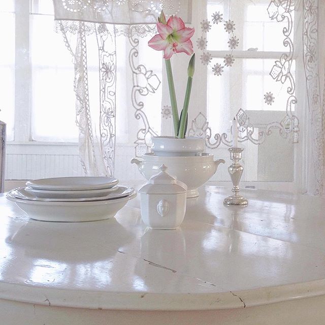 White on white Nordic kitchen style with ironstone, lace curtains, and vintage painted furniture - My Petite Maison.