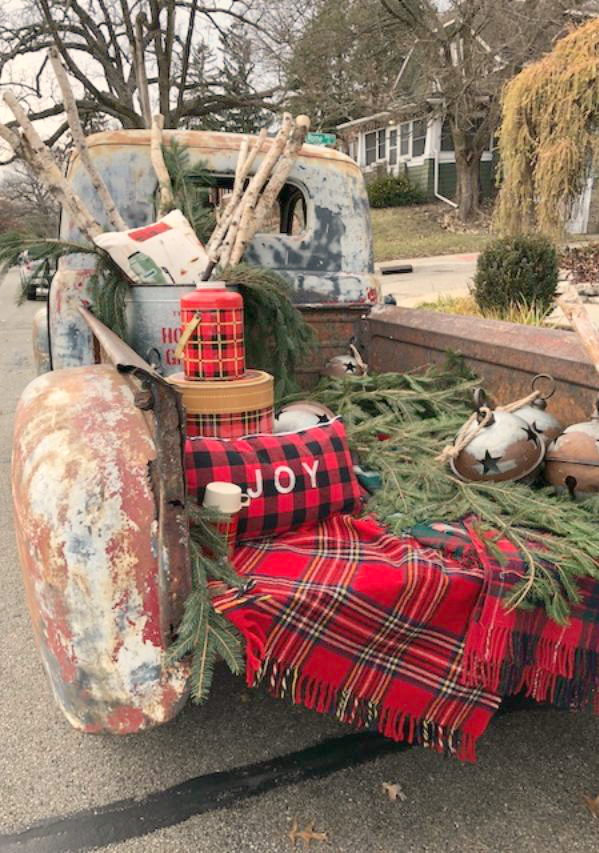 Vintage truck filled with farmhouse Christmas decor at Urban Farmgirl in Rockford, IL. Hello Lovely Studio.