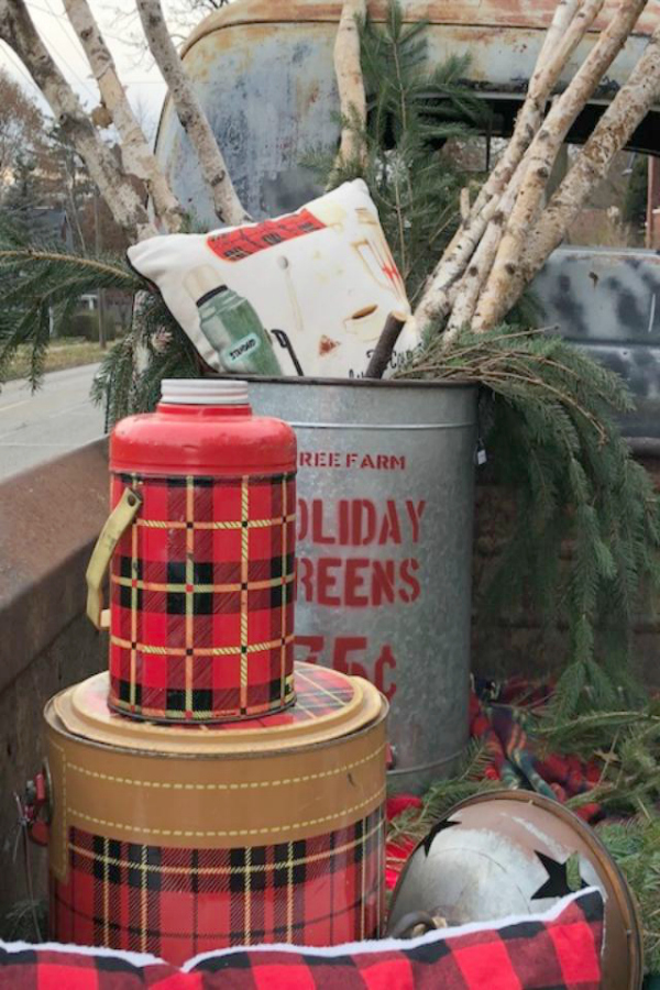 Christmas plaid and vintage style meet in the tailgate of a farmhouse Christmas pickup truck at Urban Farmgirl in Rockford, IL. Hello Lovely Studio.