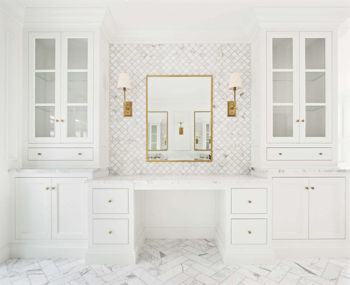 White calacatta marble luxurious bathroom design by The Fox Group with makeup area. #bespokebathdesign #bespokevanities #custombathroomvanities