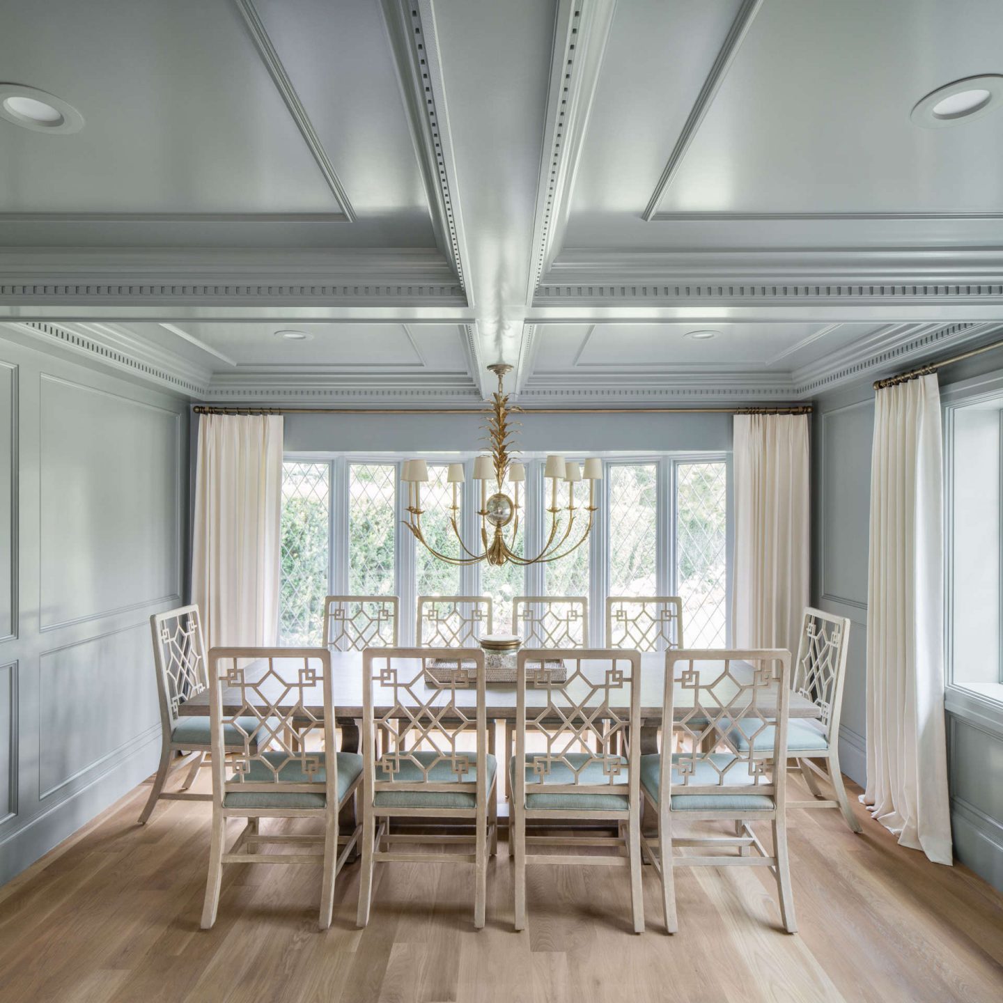 Magnificent paneling on walls and ceiling of a dining room by the Fox Group in a renovated Tudor home. Come explore these timeless design ideas...hello lovely indeed. #diningroom #thefoxgroup #millwork #traditional