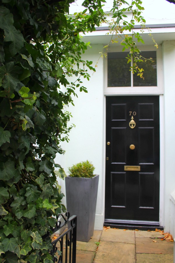 Classic black door in London. Notting Hill beauty, classic architecture, and inspiration from a London stroll by Hello Lovely Studio. Personal Reflections: What Does Greater Kindness to Yourself Look Like?