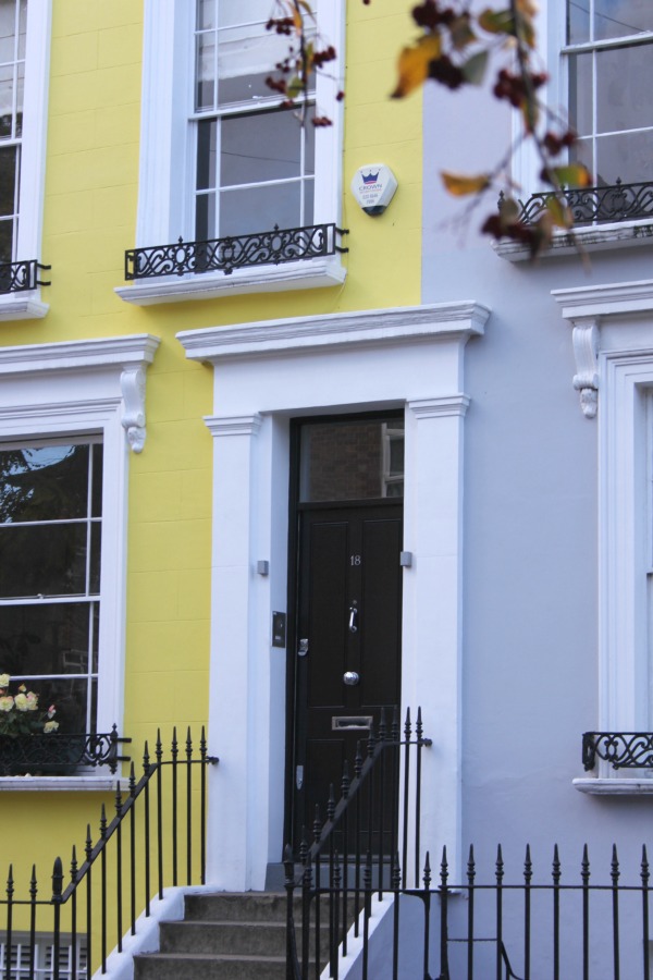 Bright yellow stucco townhouse in London. Hello Lovely Studio. Come tour these gorgeous front doors in Notting Hill and Holland Park...certainly lovely indeed. Curb appeal and Paint Color Inspiration. Lovely London Doors & Paint Color Ideas!