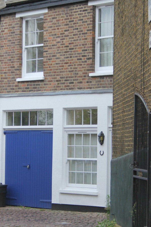 Bright blue doors on home converted from stable. Hello Lovely Studio. Come tour these gorgeous front doors in Notting Hill and Holland Park...certainly lovely indeed. Curb appeal and Paint Color Inspiration. Lovely London Doors & Paint Color Ideas!