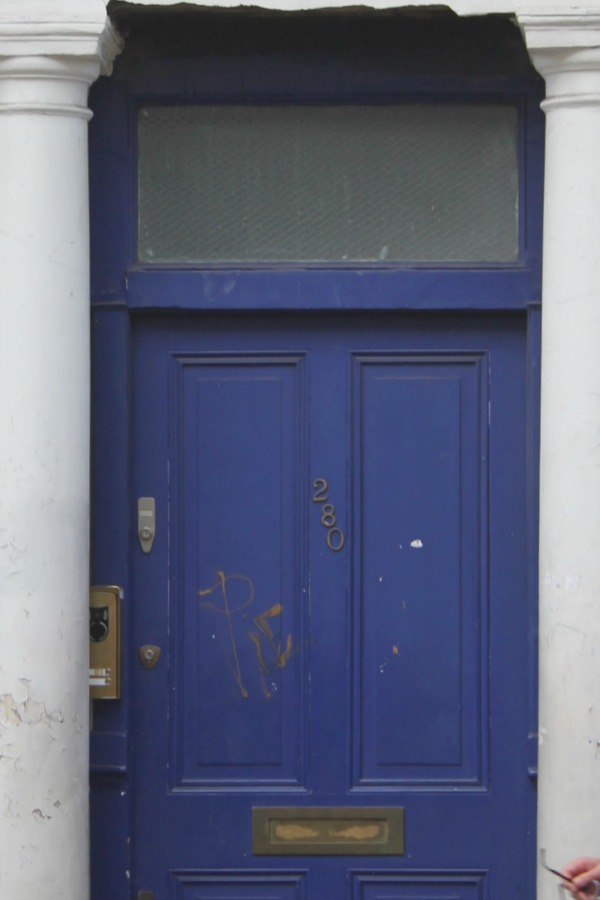 Detail of blue door to Notting HIll flat of Hugh Grant's character in the film "Notting Hill." Photo by Hello Lovely Studio.