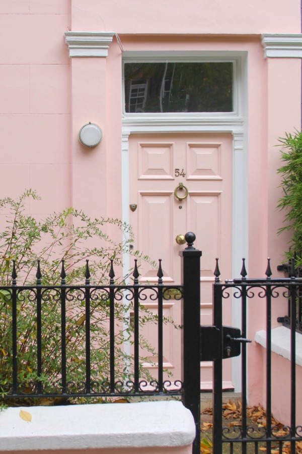 Light pink door on pink stucco row house in London. Hello Lovely Studio. Come tour these gorgeous front doors in Notting Hill and Holland Park...certainly lovely indeed. Curb appeal and Paint Color Inspiration. Lovely London Doors & Paint Color Ideas!