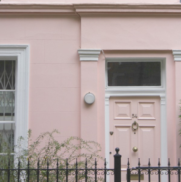 Pink townhouse in Notting Hill with pink door and gorgeous details.