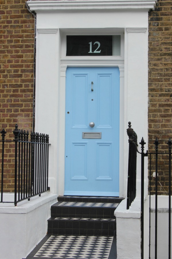 Bright baby blue door on elegant brick row house. Hello Lovely Studio. Come tour these gorgeous front doors in Notting Hill and Holland Park...certainly lovely indeed. Curb appeal and Paint Color Inspiration. Lovely London Doors & Paint Color Ideas!