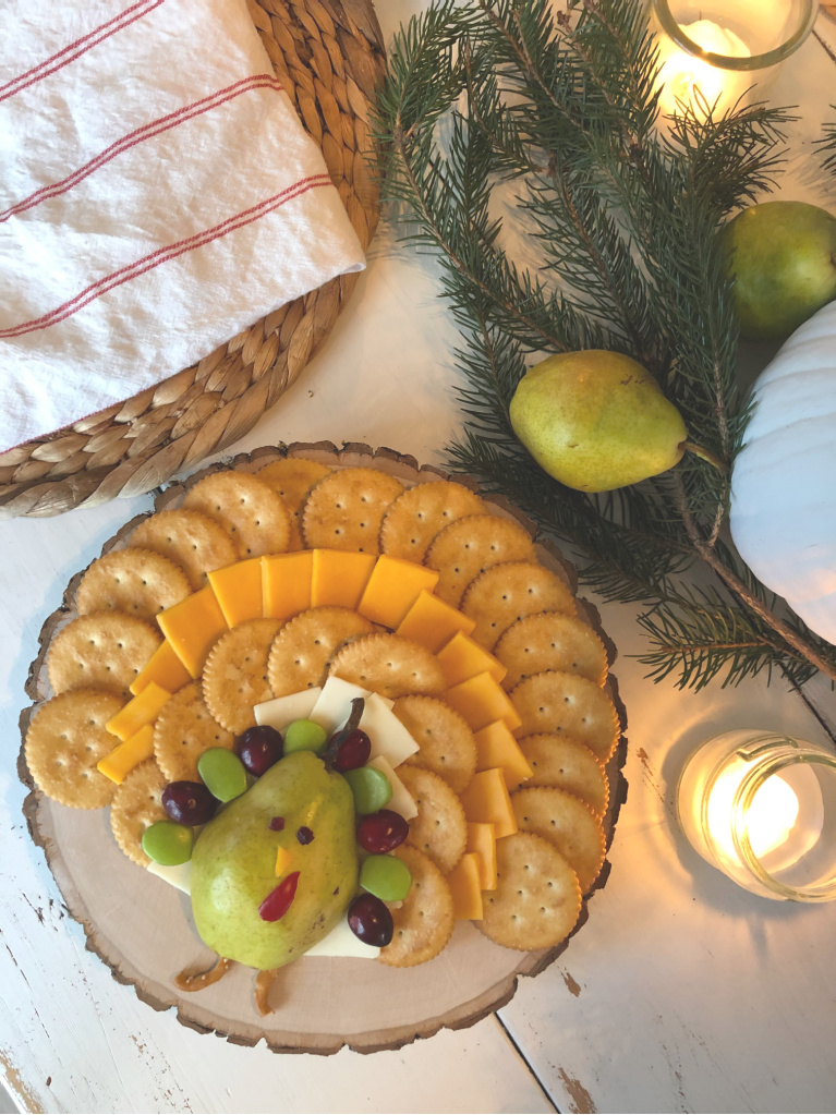 Sweet idea for an easy cheese board with pear shaped turkey on my Thanksgiving farm table - Hello Lovely Studio.