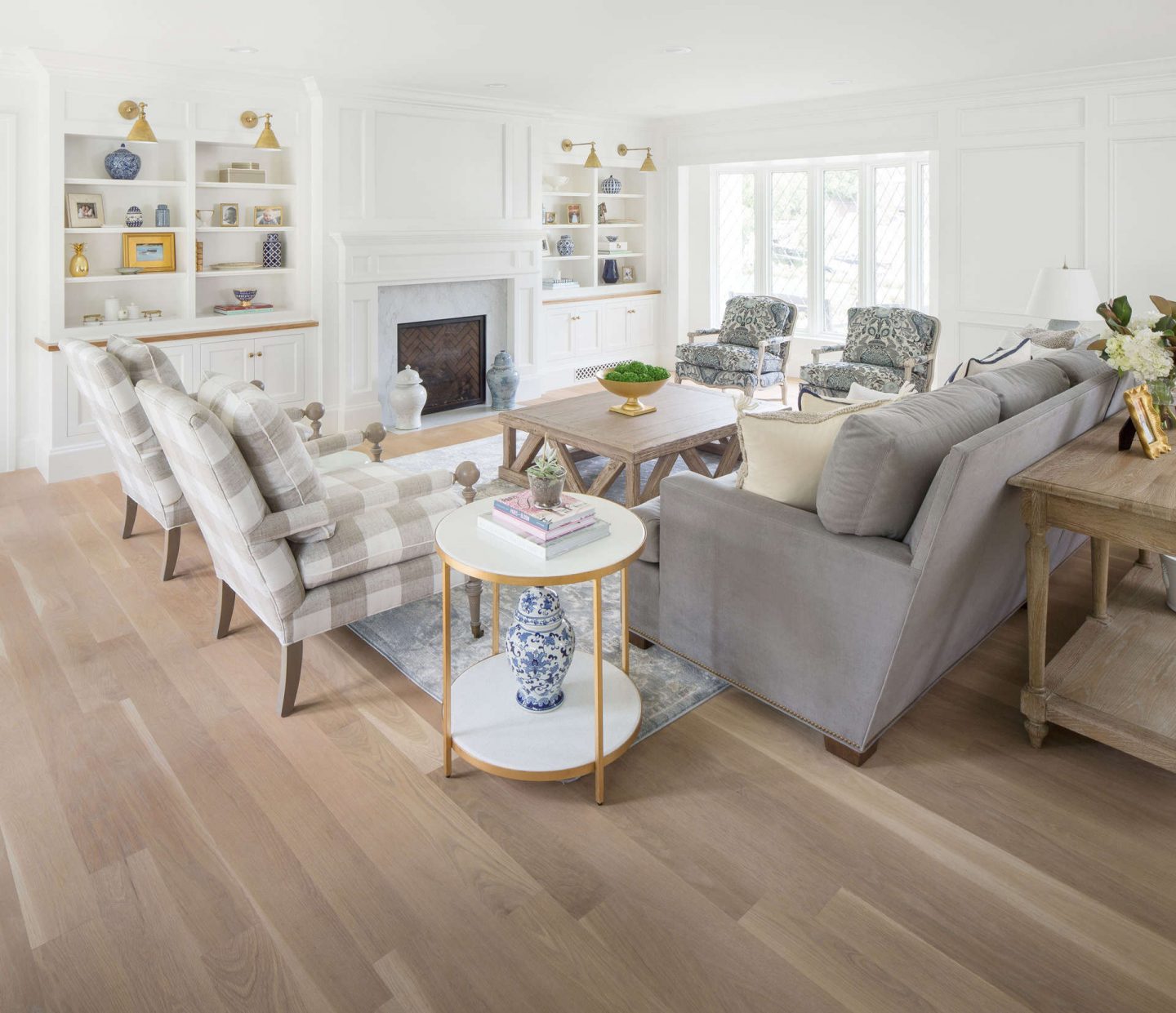 Built-ins flank a fireplace in classic living room in a Tudor home by The Fox Group. Explore timeless decorating ideas and paint colors. #thefoxgroup #livingroombuiltins