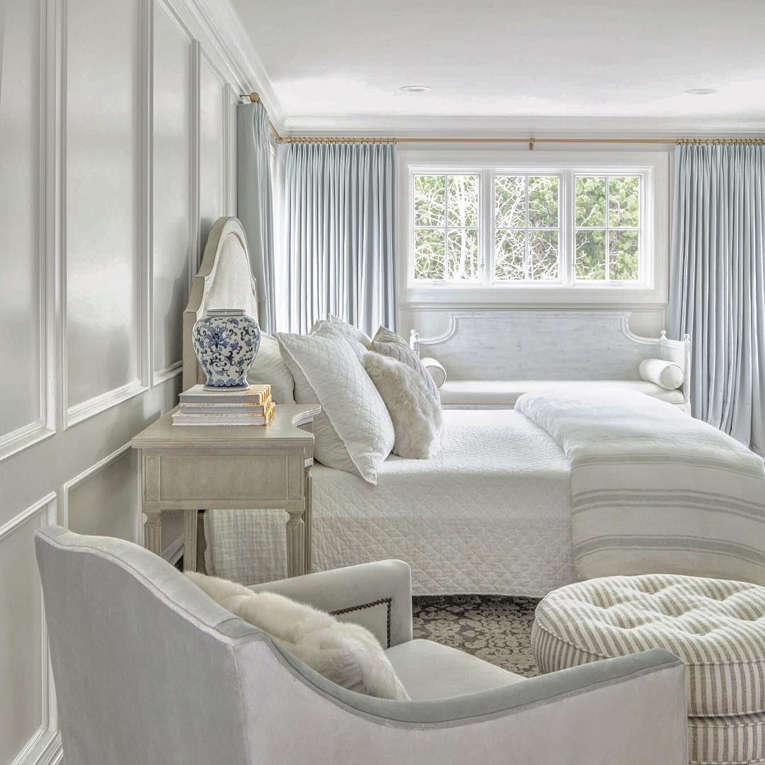 Classic traditional wainscoting and timeless design in a serene bedroom with light blue and quiet subtle decor by #thefoxgroup