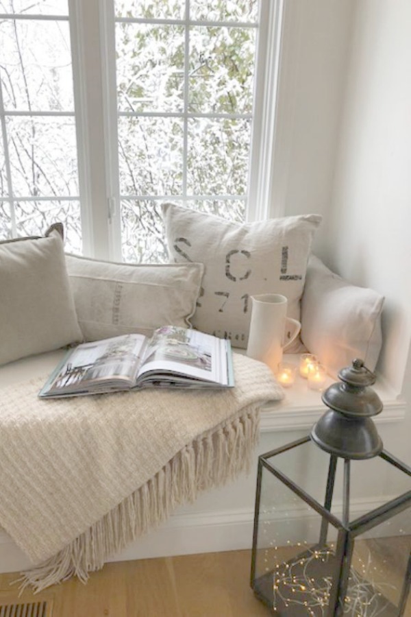 Neutral decor in a European country inspired kitchen with window seat by Hello Lovely Studio. Love Letter to Belgian Linen: The Loveliness of Living With Linen's Natural, Wabi Sabi Charm!