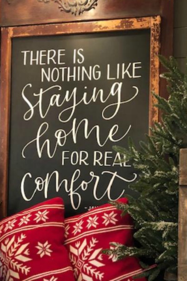 Simple farmhouse style country Christmas decorations with signage and red alpine pillows from Urban Farmgirl. #countrychristmas #farmhousechristmas #christmasdecor #holidaydecorating