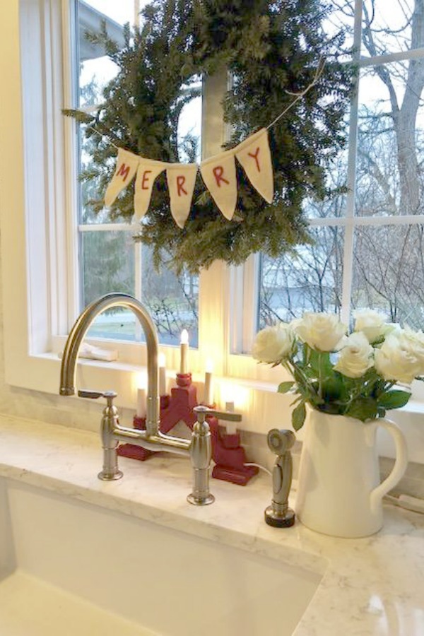 Farm sink, Swedish candelabra, and white roses - Hello Lovely Studio - Christmas 2018.