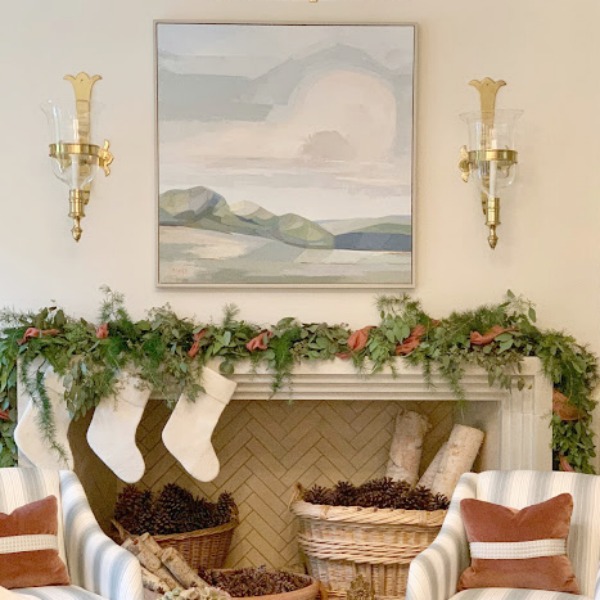 Glorious fireplace in traditional living room decorated for Christmas. Interior design by Lauren DeLoach. #holidaydecor #fireplace #interiordesign #stockings #sherwinwilliams #shojiwhite