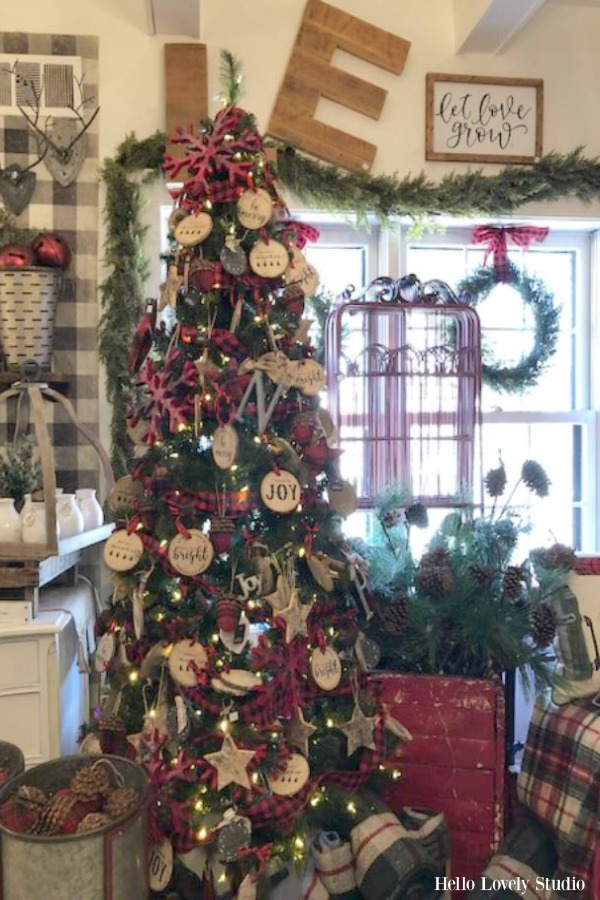 Christmas tree decorated with wood slice ornaments at Urban Farmgirl. #holidaydecor #christmastree