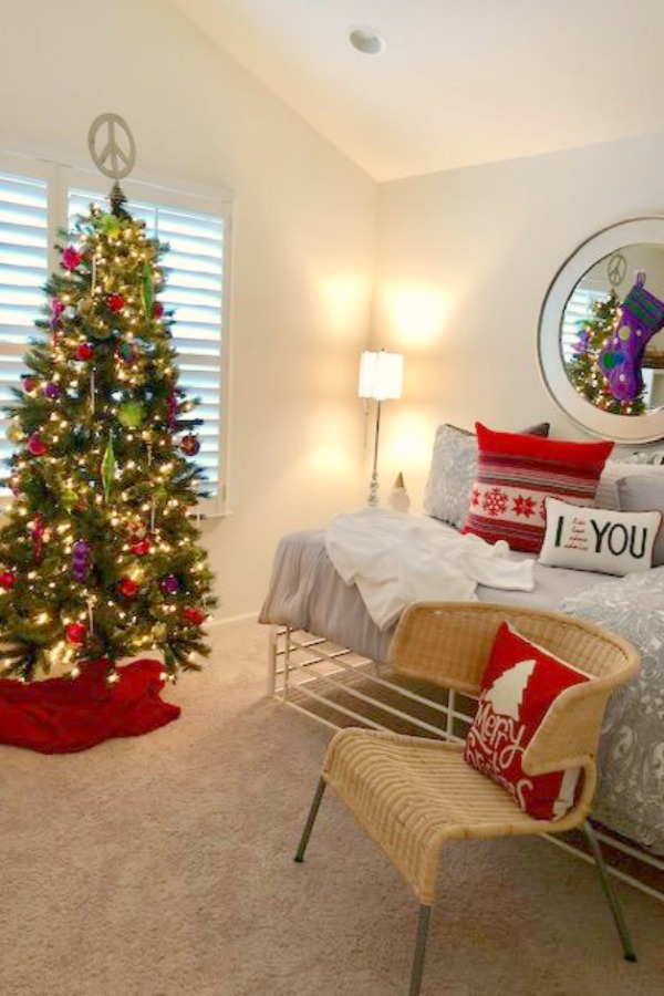 Guest bedroom decorated for Christmas with pops of red. Hello Lovely Studio.