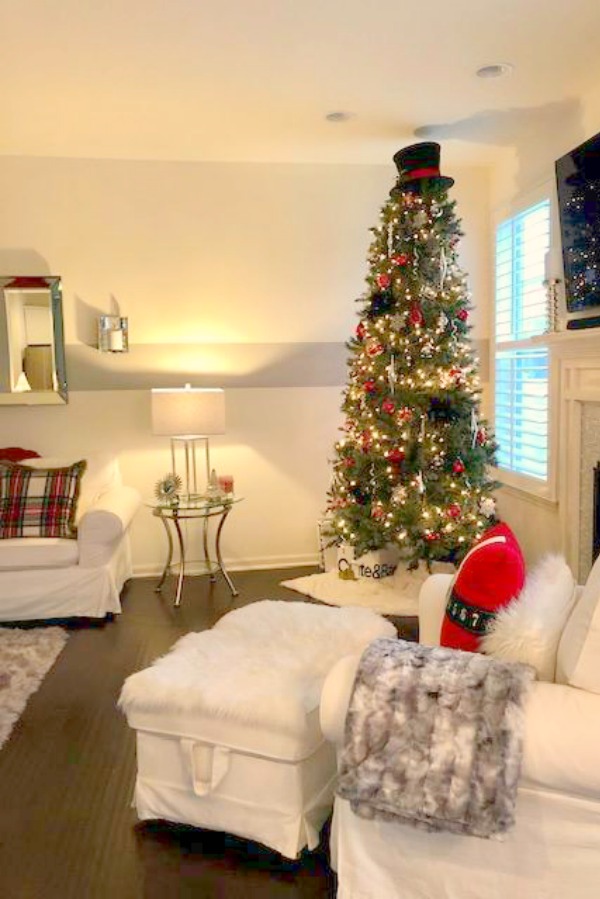 White Ikea Ektorp chair and sofa in a townhouse decorated for Christmas. Hello Lovely Studio.