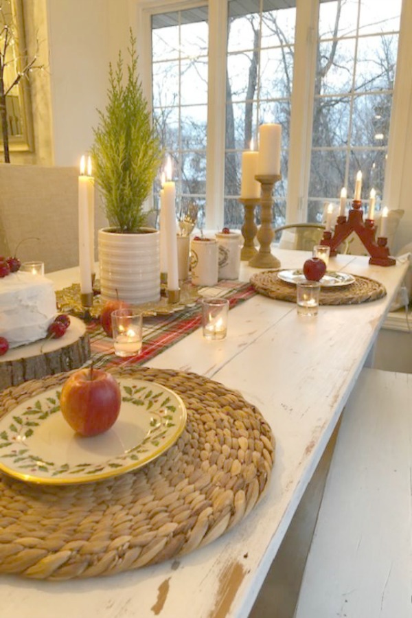 Farmhouse Christmas tablescape with red cherries, plaid, and holly Lenox plates. Hello Lovely Studio. Come find the mini cake recipe and sources for decor! #hellolovelystudio #tablescape #christmas #cherries #cake