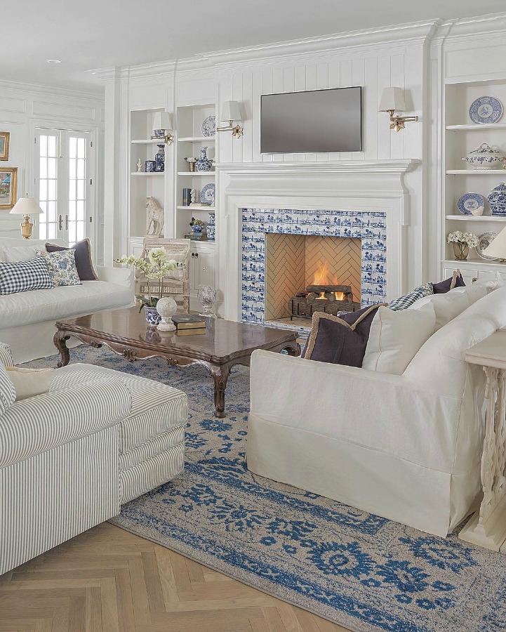 Gorgeous and sophisticated white and blue living room by The Fox Group.