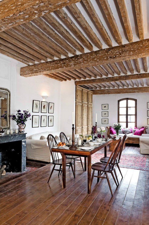 Beautiful French farmhouse with hardwood flooring, marble fireplace and rustic wood ceiling beams - Haven In.