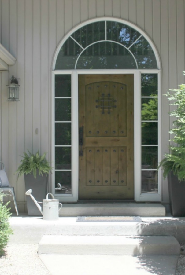 Our rustic knotty alder door with speakeasy. #hellolovelystudio #alderdoor