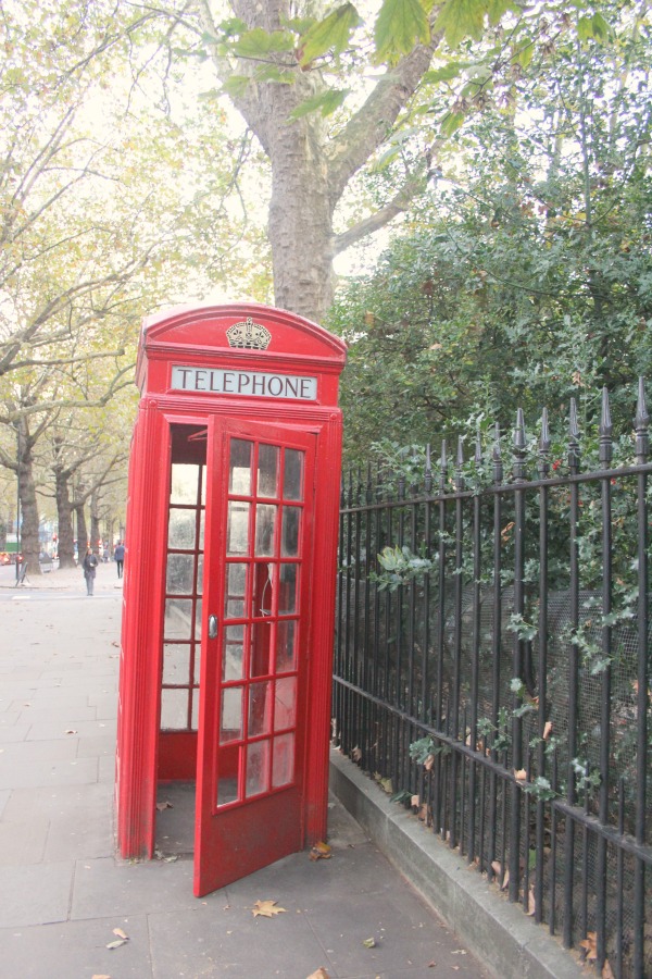 Classic British red telephone booth in London. Notting Hill beauty, classic architecture, and inspiration from a London stroll by Hello Lovely Studio. Personal Reflections: What Does Greater Kindness to Yourself Look Like?