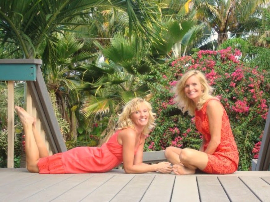 Sisters in coral sun dresses in Hawaii. Hello Lovely Studio.