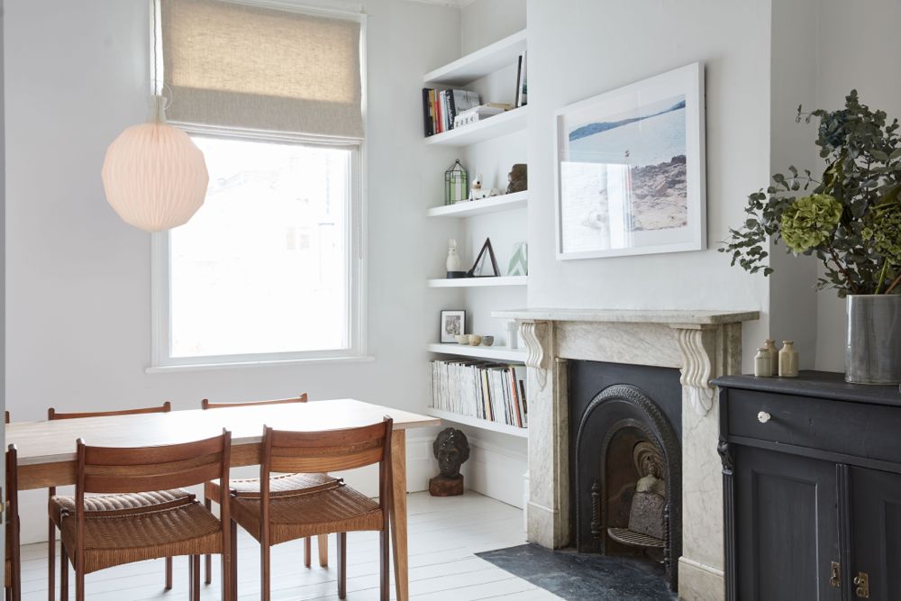 All white decor with simplicity, rustic design elements, and understated simplicity in a London Home offered by The Beach Studios. #whitedecor #housetour #simpledecor #interiordesign #vintagestyle #shabbychic