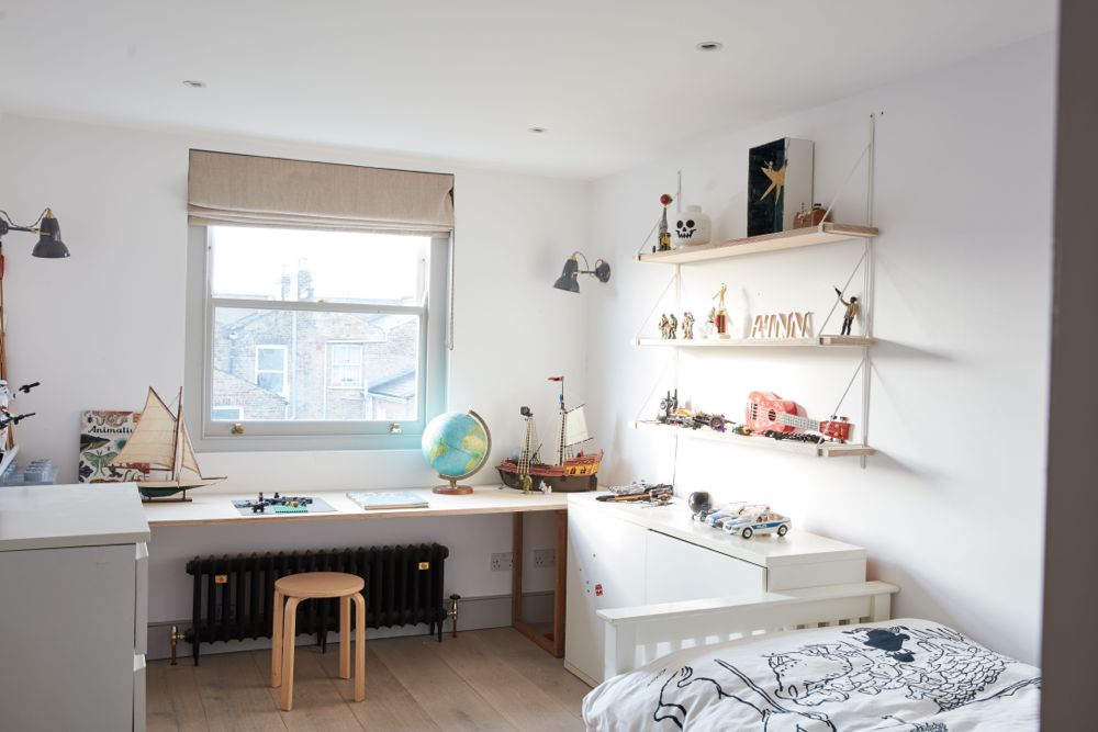 All white decor with simplicity, rustic design elements, and understated simplicity in a London Home offered by The Beach Studios. #whitedecor #housetour #simpledecor #interiordesign #vintagestyle #shabbychic