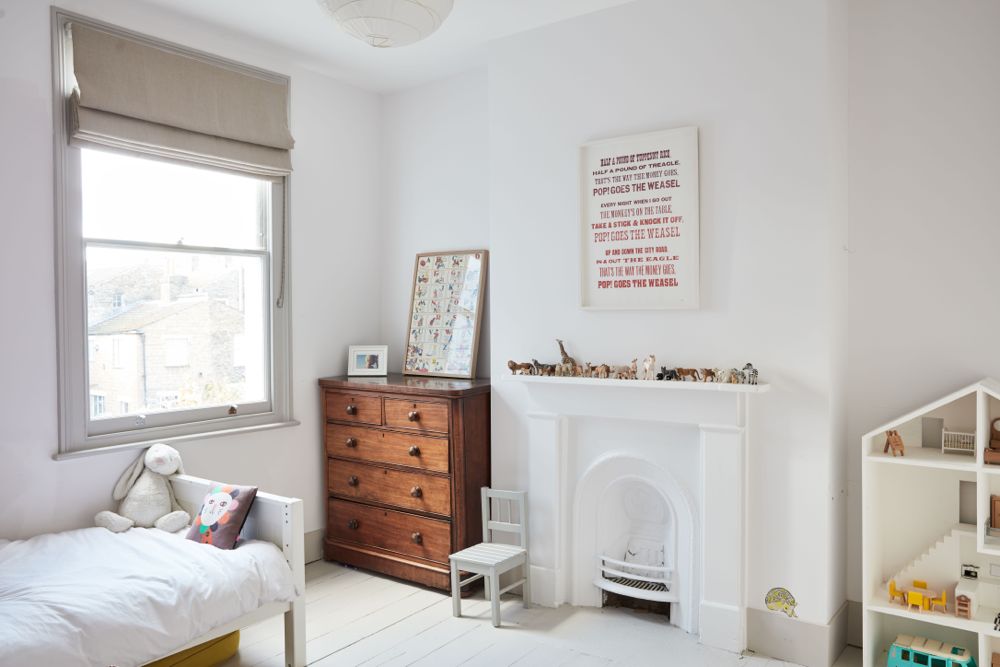 All white decor with simplicity, rustic design elements, and understated simplicity in a London Home offered by The Beach Studios. #whitedecor #housetour #simpledecor #interiordesign #vintagestyle #shabbychic