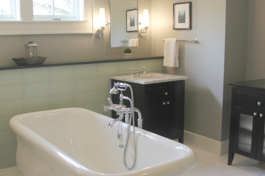 Luxurious modern bathroom with freestanding tub (Waterworks) and his and her sinks. Serene Spa-like Bathroom Design Ideas.