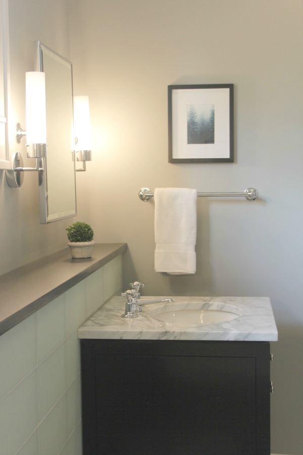 Luxurious modern bathroom with freestanding tub (Waterworks) and his and her sinks. Serene Spa-like Bathroom Design Ideas.