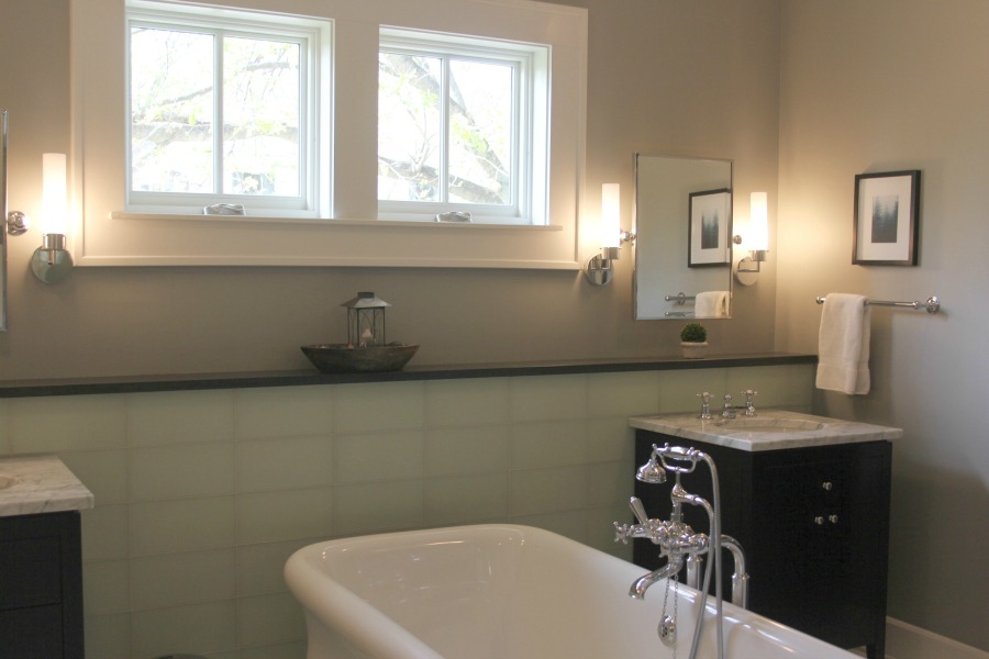 Luxurious modern bathroom with freestanding tub (Waterworks) and his and her sinks. Serene Spa-like Bathroom Design Ideas.