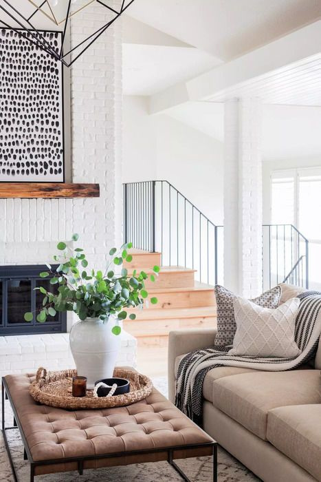 Scout & Nimble designed living room with white brick fireplace and modern rustic style. #modernrustic #livingroom #warmmodern