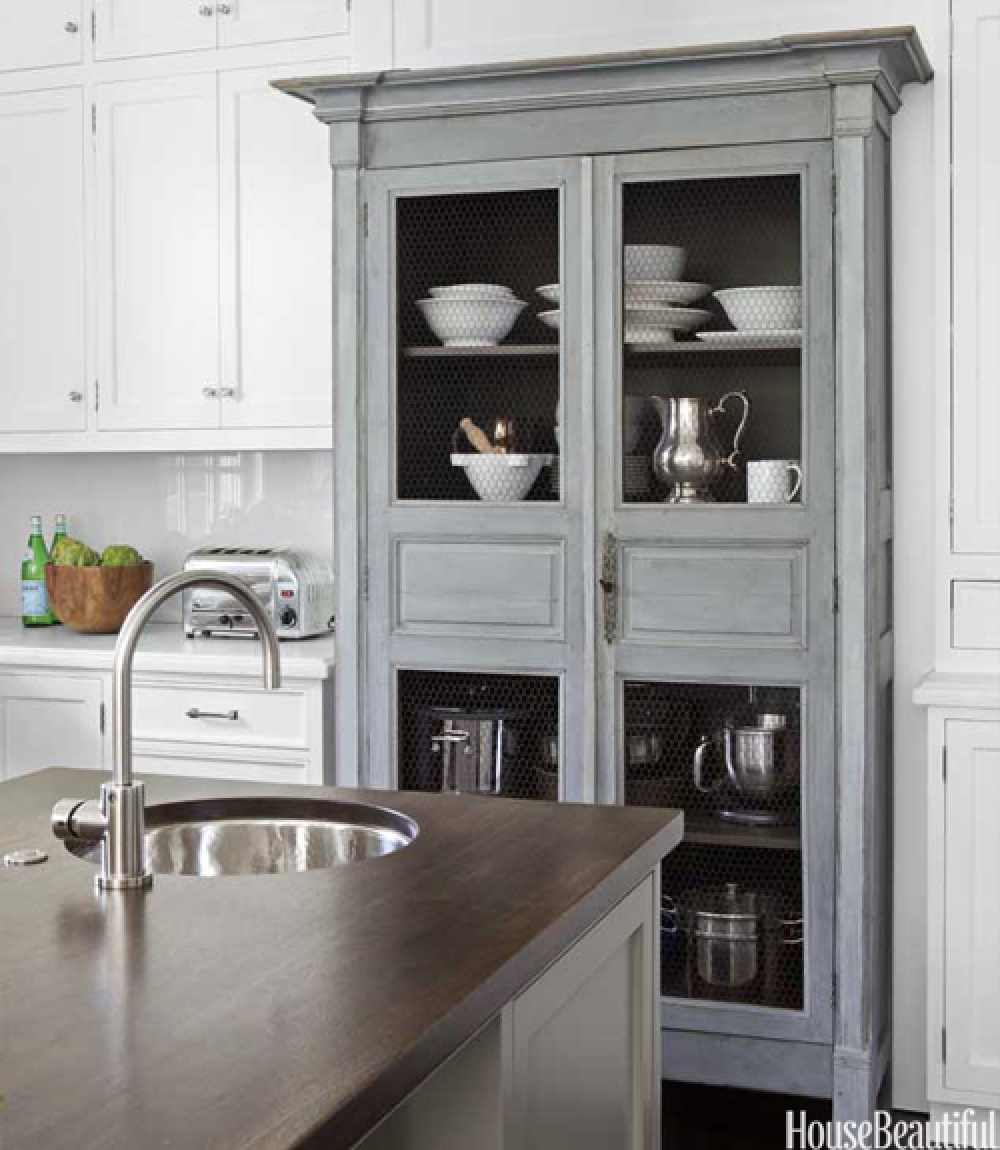 Vintage grey painted pie safe built into custom cabinetry in a coastal kitchen by Samantha Lyman - House Beautiful (2012). #coastalgrandmother #coastalkitchen #somethingsgottagivekitchen