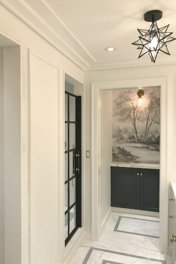 What a timeless and tranquil understated bathroom design with marble flooring and custom Susan Harter wallpaper mural.