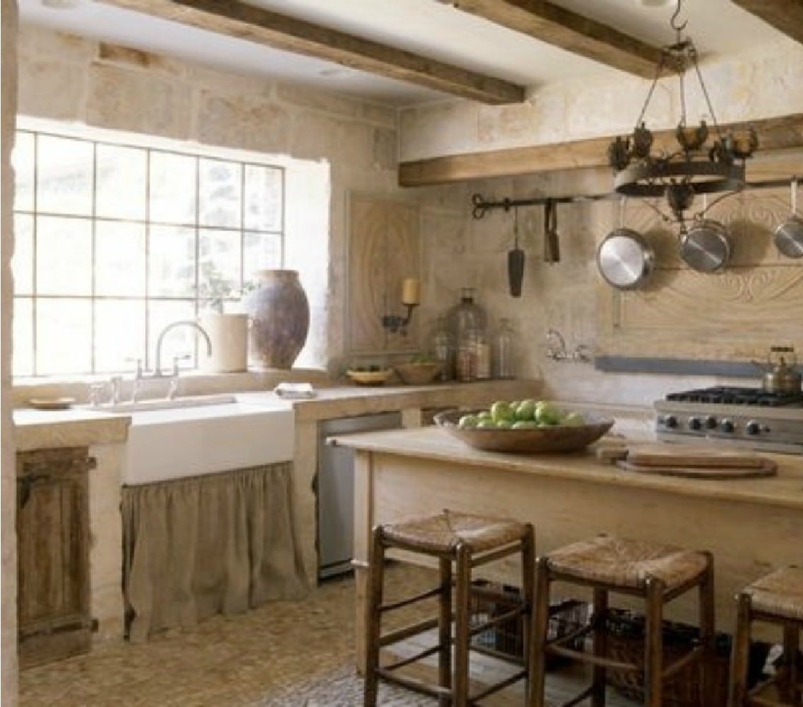 French farmhouse kitchen of Ruth Gay of Chateau Domingue. Pale and Lovely European Country White Interiors to Inspire with photo gallery. #frenchfarmhouse #interiordesign #frenchcountry