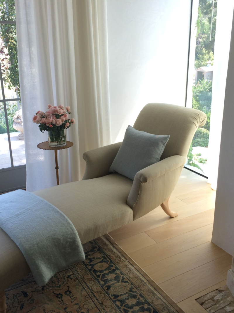 Beautiful chaise in master bedroom of Patina Farm by Giannetti Home.