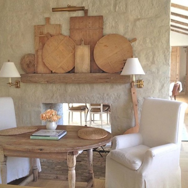 French farmhouse limestone fireplace and antiques in Patina Farm Kitchen - Giannetti Home. #frenchfarmhouse #fireplace #patinafarm #giannettihome