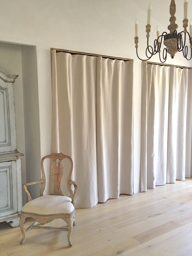 Linen drapery panels in lieu of closet doors at Patina Farm in master bedroom.