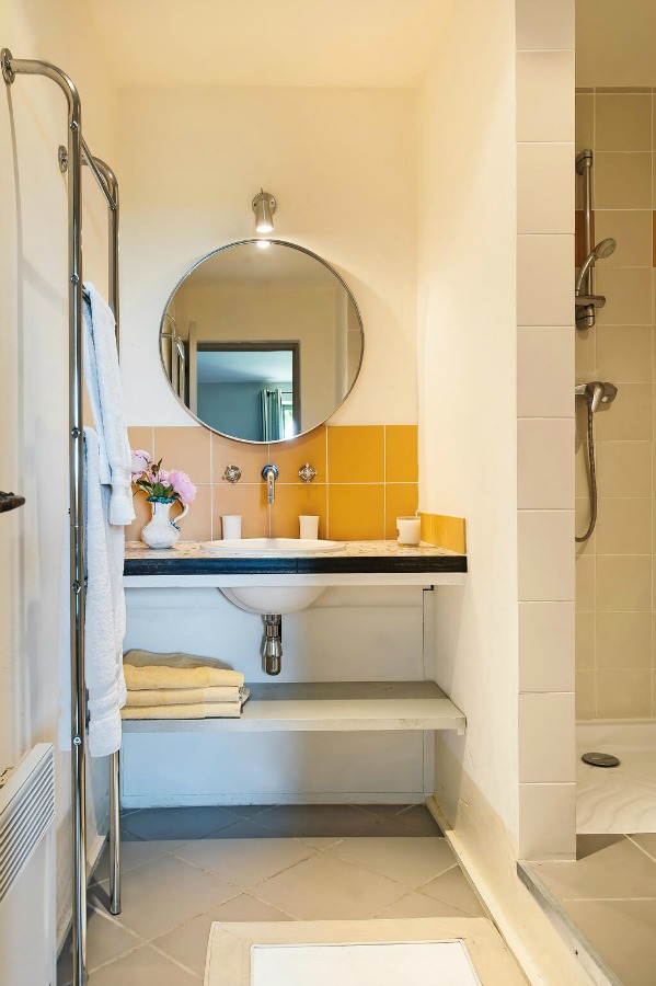 Marigold yellow bathroom tile. Provence dreams are made of these! Come tour French Farmhouse Design: Provence Villa Photos in a story with rustic decor, Country French charm, and South of France beauty! #frenchfarmhouse #interiordesign #housetour #frenchcountry #provence