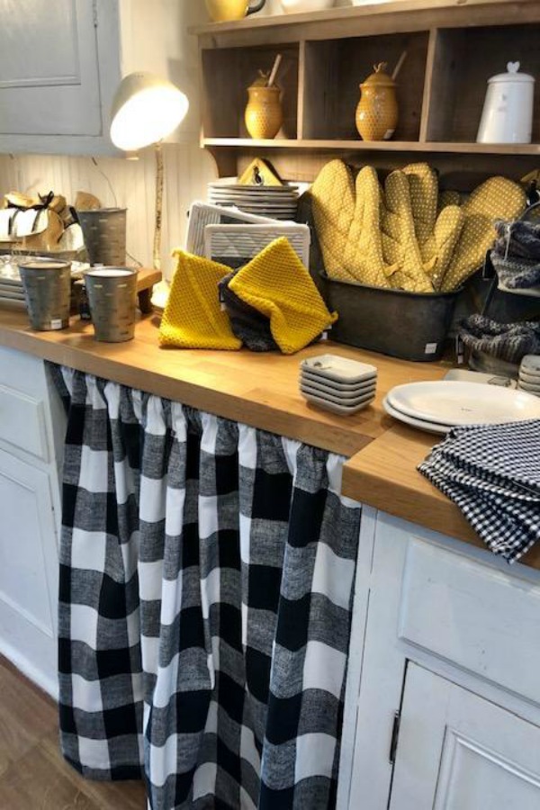 Accents of yellow and black on a country kitchen counter with farmhouse decor. Photo by Hello Lovely Studio. #urbanfarmgirl 