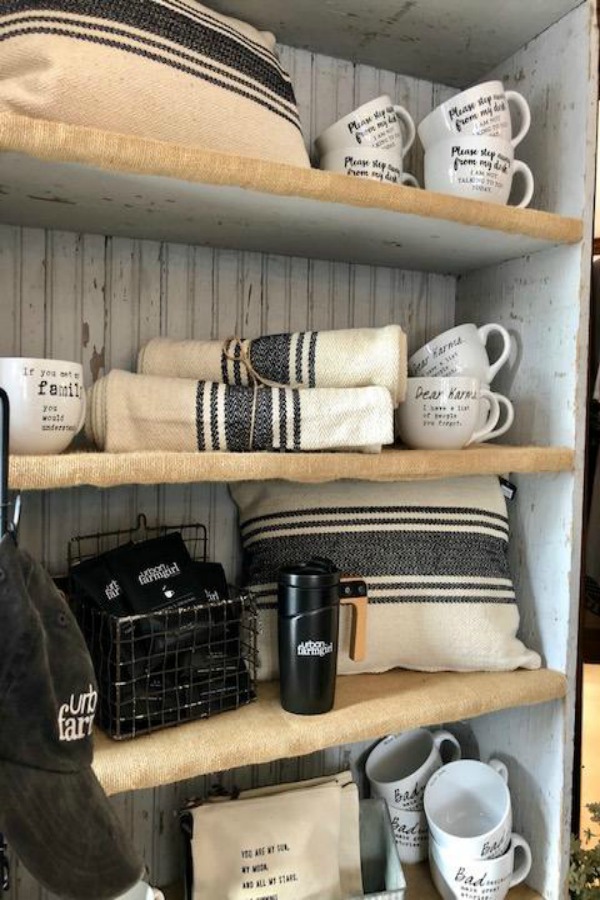 Rustic country shelves with beadboard backing and farmhouse decor at Urban Farmgirl. Photo by Hello Lovely Studio.