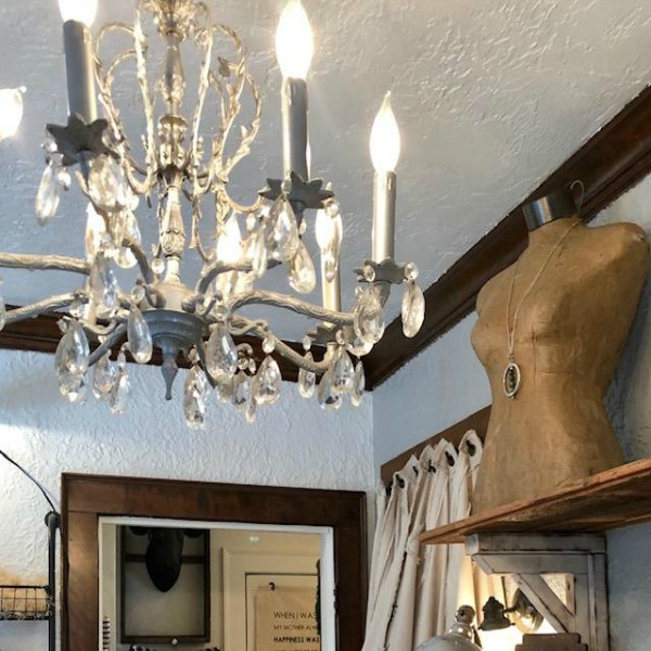 Vintage chandelier and dress form at Urban Farmgirl.