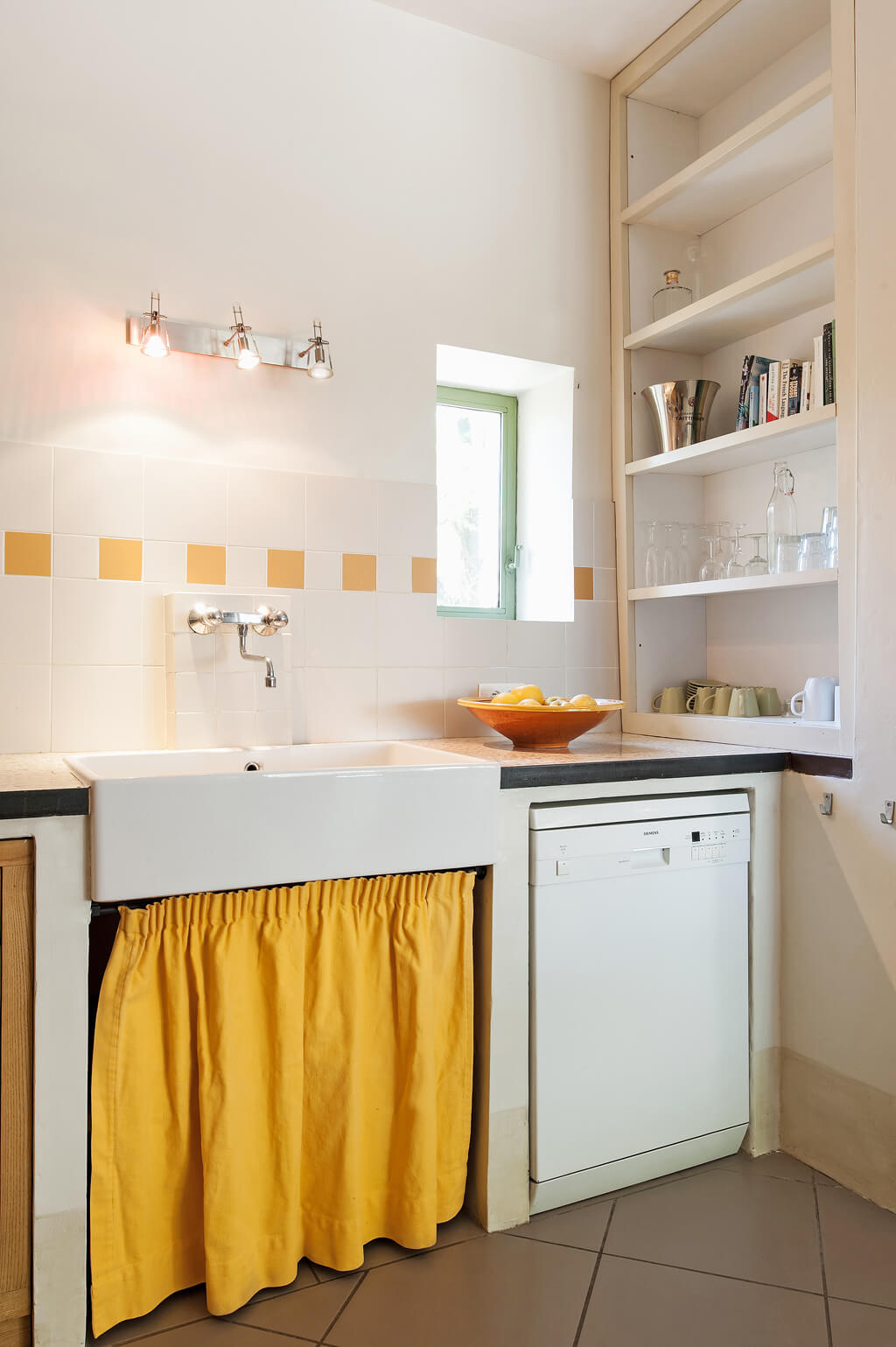 Charming Provence kitchen with bright sunshine yellow skirted sink and accents - Haven In. #frenchkitchen #frenchcountry #brightyellow