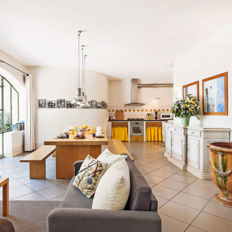 Charming Provence kitchen with bright sunshine yellow skirted sink and accents - Haven In. #frenchkitchen #frenchcountry #brightyellow