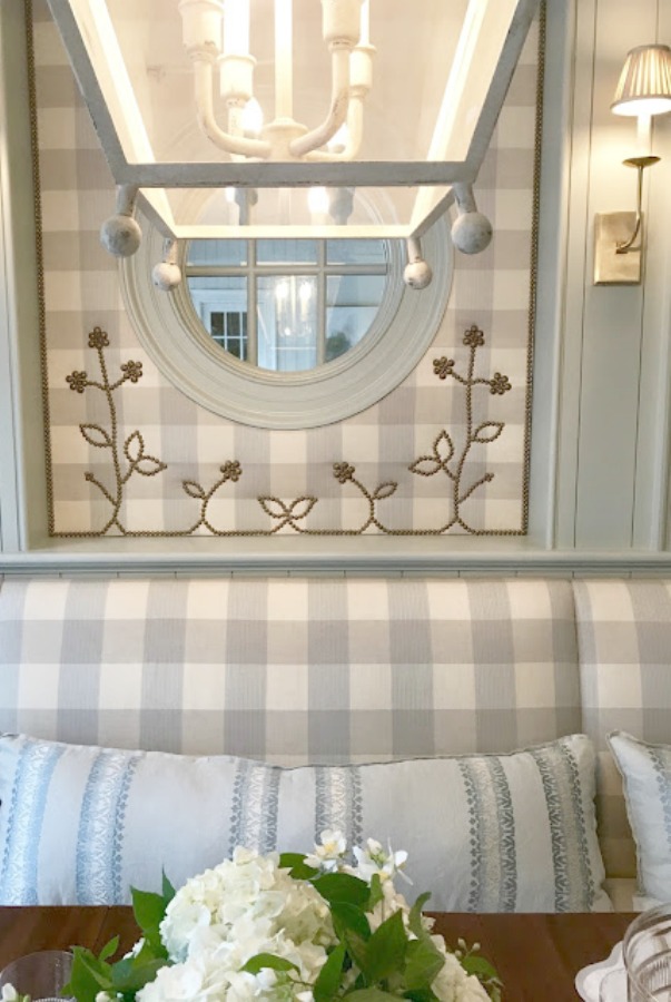 Blue and white buffalo check upholstery on a banquette in a lovely custom kitchen dining area. Atlanta Homes Designer Showhouse 2017.