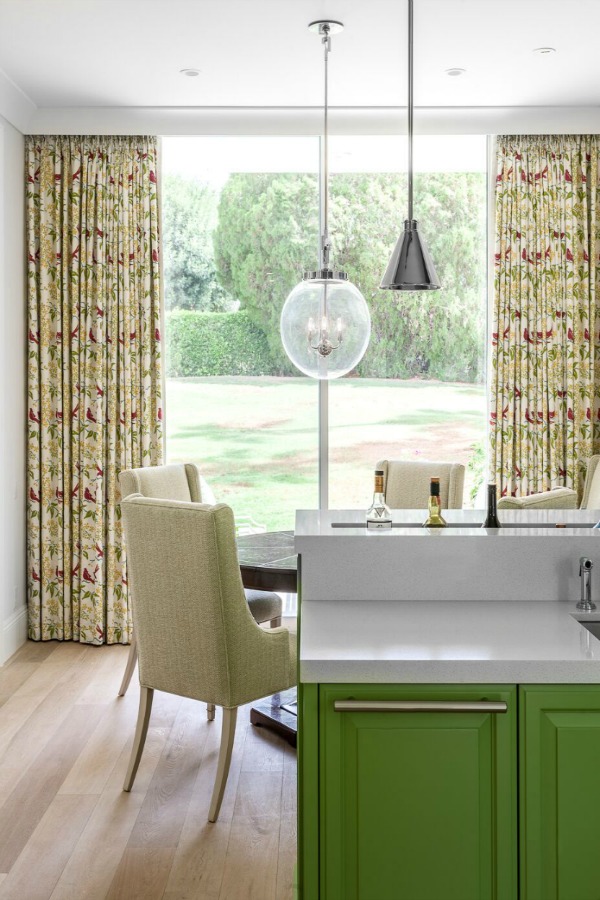 Vibrant apple green painted kitchen cabinets in a beautiful kitchen design by Tom Stringer.