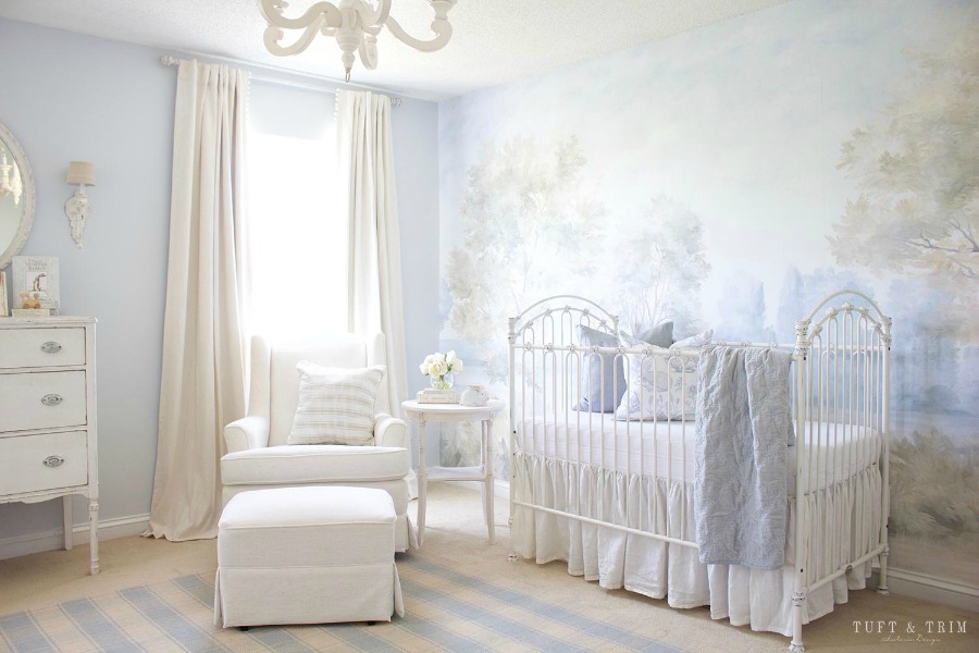 Magnificent landscape mural wallpaper in a nursery designed by Tuft & Trim, made from original painting by Susan Harter. Muted and sophisticated colors in this beautifully inspiring interior design. #mural #interiordesign #timeless #ethereal #serenedecor #paintedmural #wallpaper